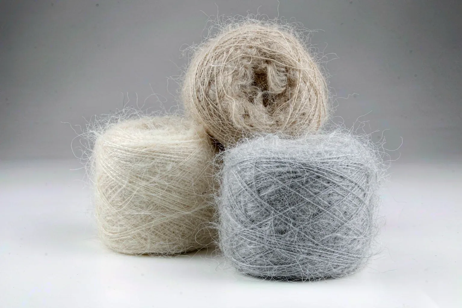Merino and mohair yarn skeins in neutral tones