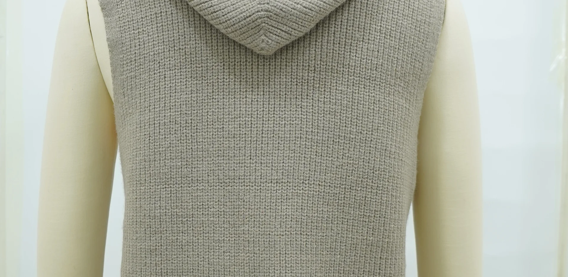 A finished knitwear sample shown on the form - the end point of the development route