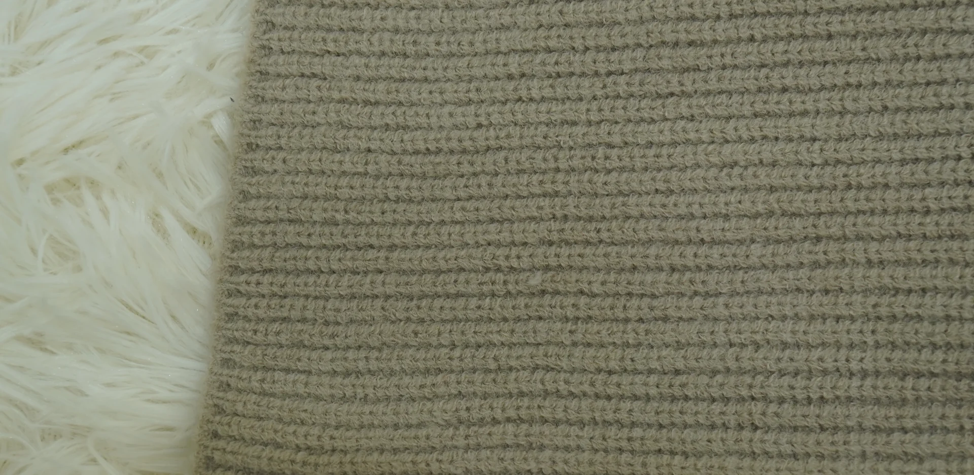 Close-up of a ribbed knitted swatch showing stitch definition and density